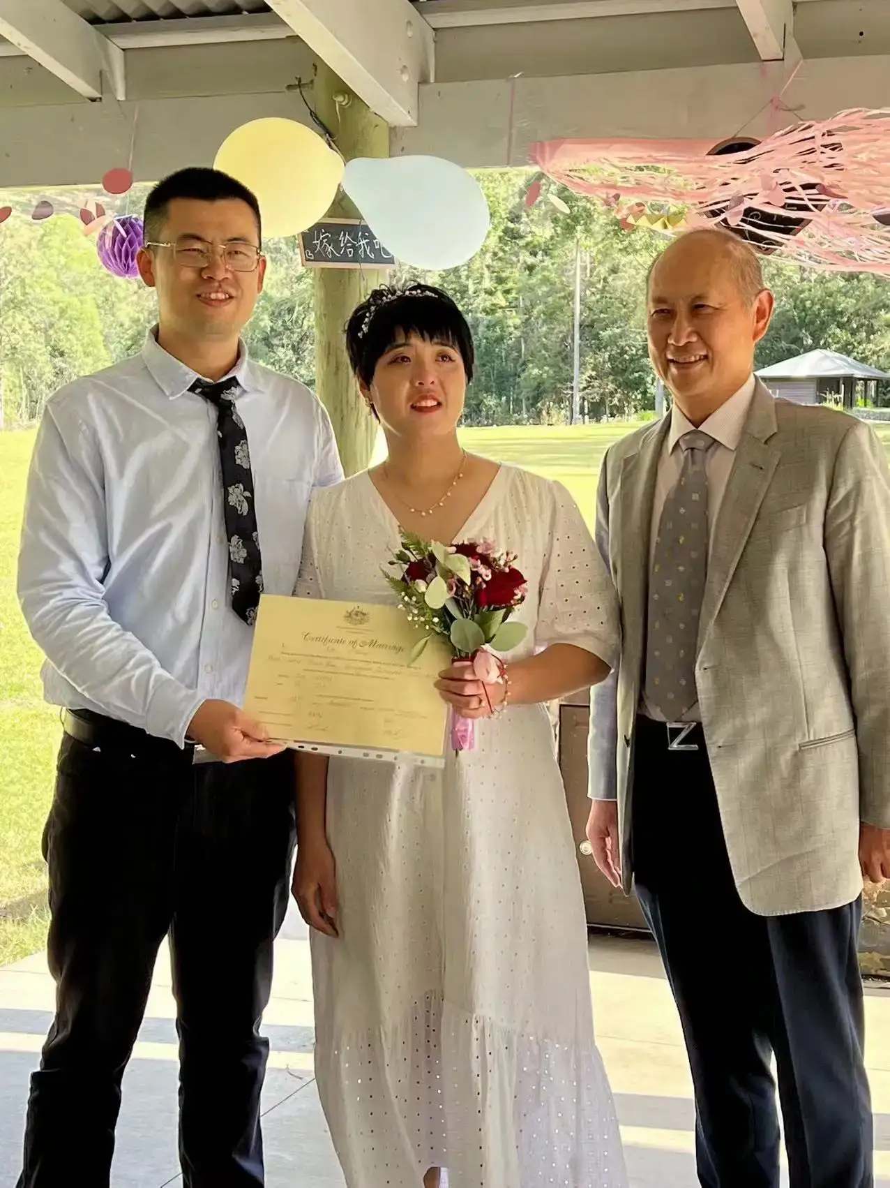 Sunnybank-wedding-couple-happy-holding-certificate